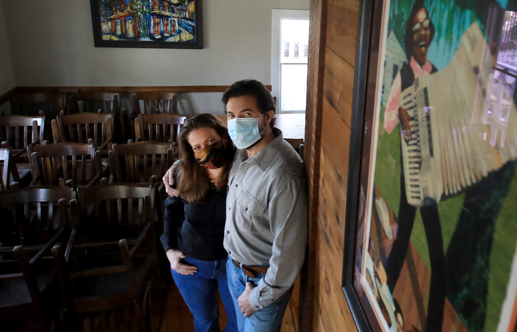 Rob, right, and Karla Lippincott of The Parish Café in Healdsburg are selling their New Orleans-style restaurant in a plan to depart California, on Thursday, Jan. 8, 2021.(Kent Porter / The Press Democrat)