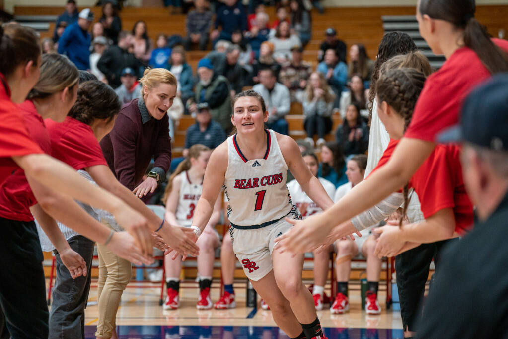 Bear Cubs guard Ciarah Michalik runs out onto the court with her teammates before their game against Laney College on Saturday, March 4, 2023 in Santa Rosa. (Nicholas Vides / For The Press Democrat)
