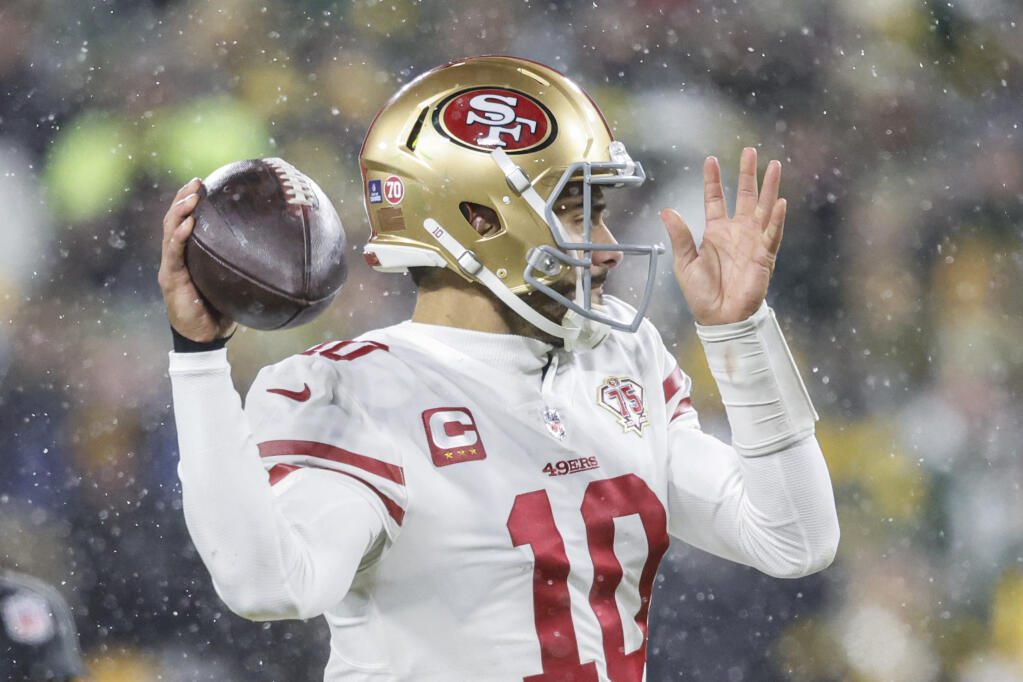 San Francisco 49ers quarterback Jimmy Garoppolo (10) throws the ball during an NFL divisional playoff football game against the Green Bay Packers, Saturday, Jan 22. 2022, in Green Bay, Wis. (AP Photo/Jeffrey Phelps)