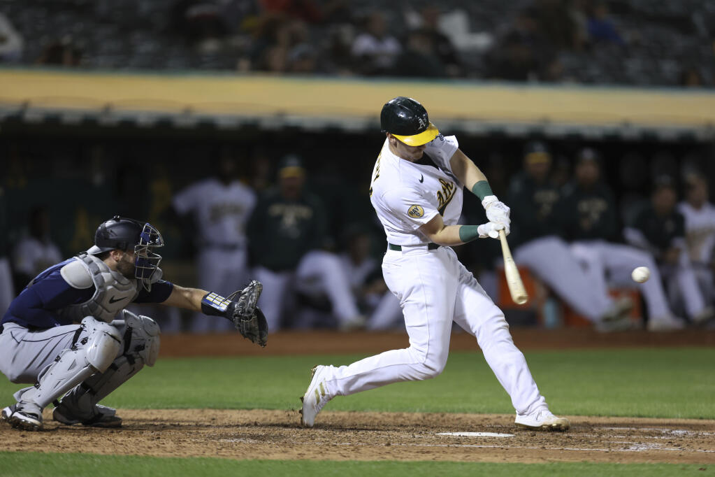 Oakland Athletics catcher Sean Murphy bats against the Seattle Mariners during a baseball game in Oakland, Calif., Tuesday, Sept. 20, 2022. (AP Photo/Jed Jacobsohn)