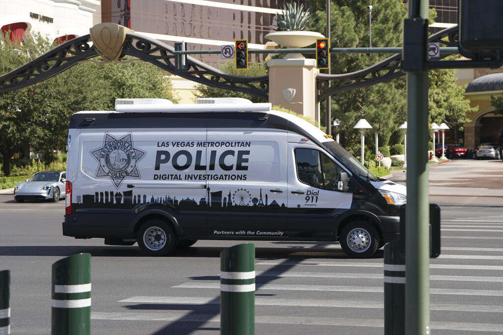 Police work at the scene where multiple people were stabbed in front of a Strip casino in Las Vegas, Thursday, Oct. 6, 2022. Police say an attacker has killed two people and wounded six others in stabbings along the Las Vegas Strip. (Brian Ramos/Las Vegas Sun via AP)