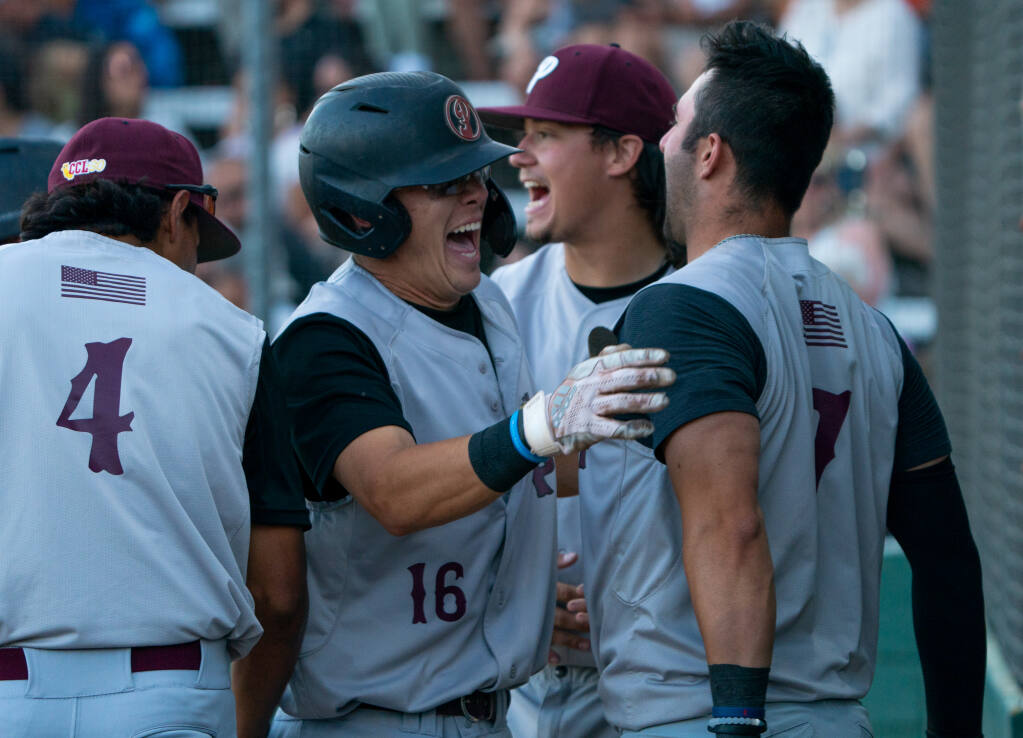 Healdsburg Prune Packer infielder Hunter Dorraugh is amped up with his teammates after hitting a home run against the Sonoma Stompers on Friday, June 30, 2023 in Sonoma. (Nicholas Vides / For The Press Democrat).