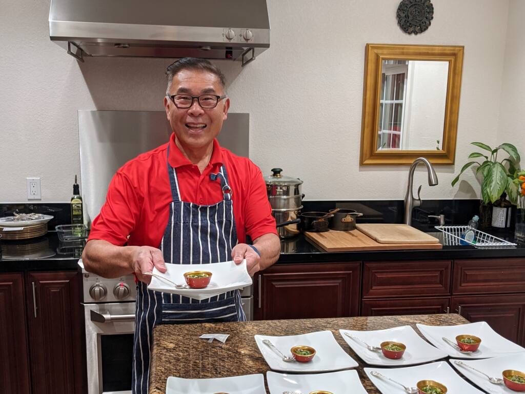 Lance Lew, seen here in his Petaluma kitchen, has a joy of cooking that is plain to see. Now others can bring that joy to their own kitchens with his new cookbook, “Welcome Winter: Making Friends with Taste and Traditions.” (Photo by Houston Porter/For the Argus Courier)