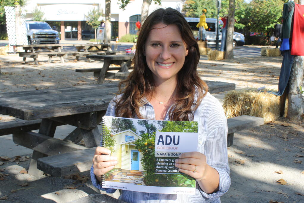 Renee Schomp, J.D., director of the Napa Sonoma ADU Center, holds the group’s 110-page 110-page workbook on planning and building an accessory dwelling unit in Napa and Sonoma counties. (Gary Quackenbush / for North Bay Business Journal)