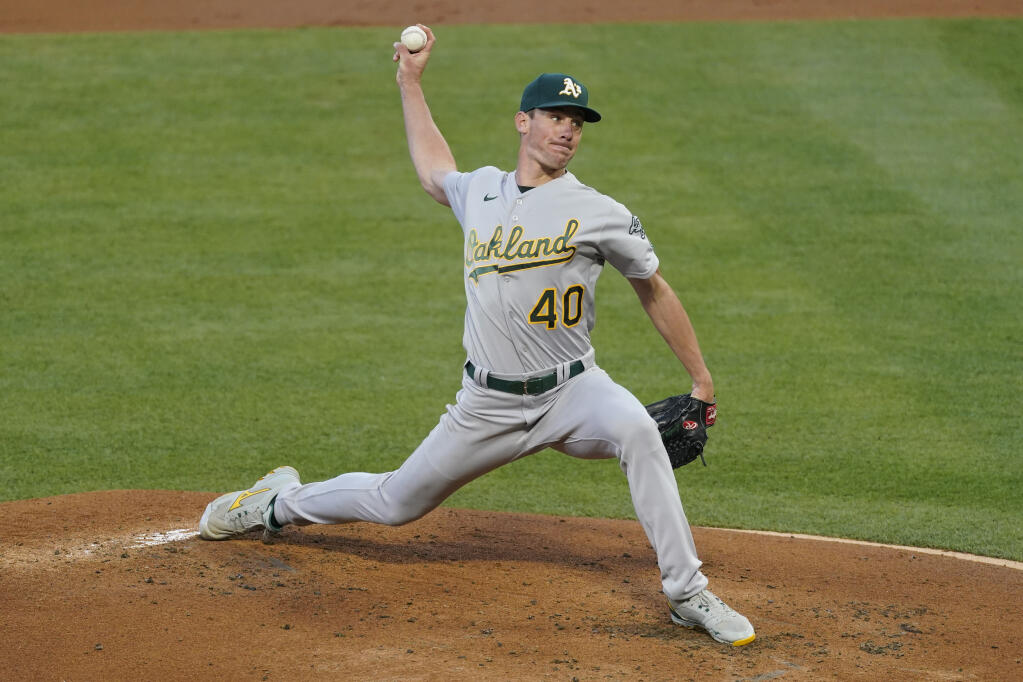 Oakland Athletics starting pitcher Chris Bassitt throws during the first inning against the Los Angeles Angels on Saturday, May 22, 2021, in Anaheim. (Ashley Landis / ASSOCIATED PRESS)