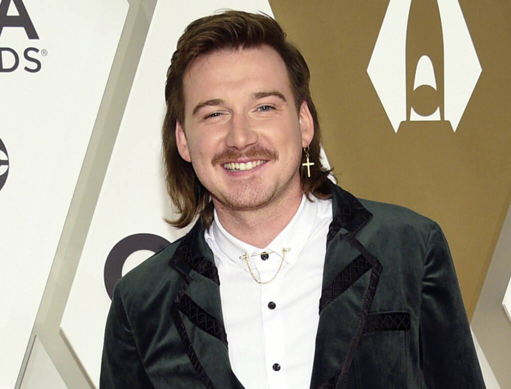 FILE - Morgan Wallen arrives at the 53rd annual CMA Awards on Nov. 13, 2019, in Nashville, Tenn. The Grand Ole Opry, country music's most historic and storied stage, is getting heavy criticism for an appearance by the country star. Wallen's surprise performance has given many the impression that the institution has given the star its blessing and a path to reconciliation after he was caught on camera last year using a racial slur. (Photo by Evan Agostini/Invision/AP, File)