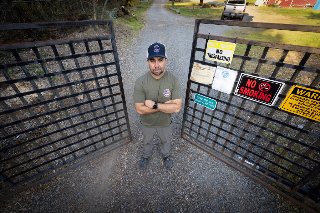Jeremy Freitas stands Thursday, Nov. 17, 2022, at the gates of Patriot Valley Farms in northern Sonoma County. Confusing and conflicting regulations and stiff fines have left him struggling to stay afloat, Freitas said. (John Burgess/Press Democrat)