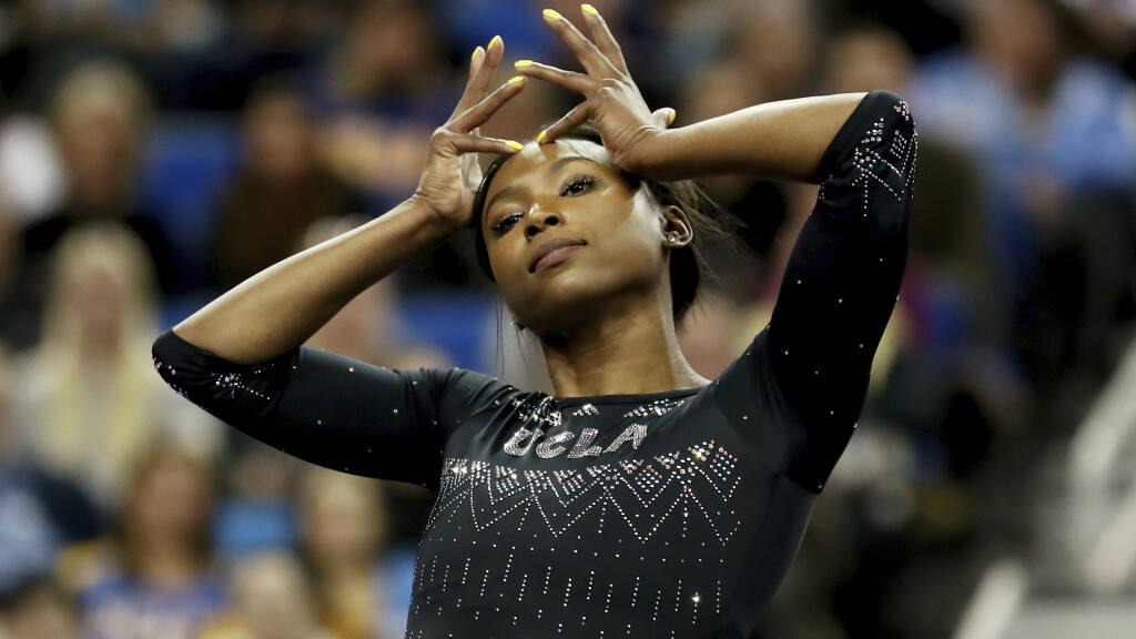 Nia Dennis of UCLA during an NCAA college gymnastics match, Friday, Jan. 4, 2019, in Los Angeles. (AP Photo/Ben Liebenberg)