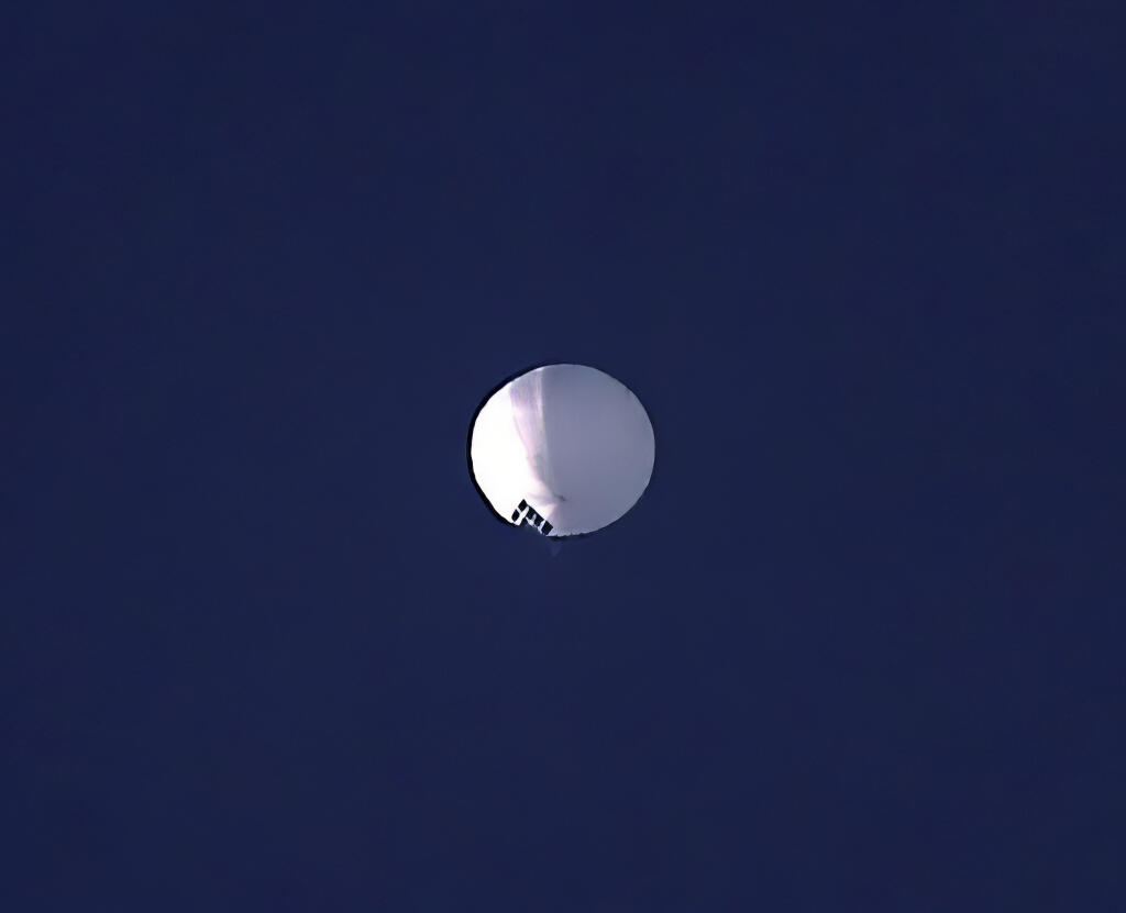 A high altitude balloon floats over Billings, Mont., on Wednesday, Feb. 1, 2023. The U.S. is tracking a suspected Chinese surveillance balloon that has been spotted over U.S. airspace for a couple days, but the Pentagon decided not to shoot it down due to risks of harm for people on the ground, officials said Thursday, Feb. 2, 2023. The Pentagon would not confirm that the balloon in the photo was the surveillance balloon. (Larry Mayer/The Billings Gazette via AP)