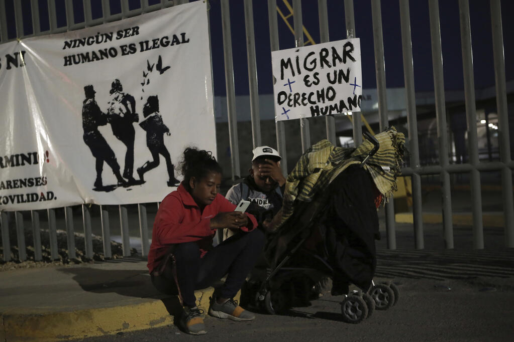 Activists and migrants join a vigil for the victims of a fire at a migration detention center in Ciudad Juarez, Mexico, Wednesday, March 29, 2023, a day after dozens of migrants died as a result of the fire. (AP Photo/Christian Chavez)