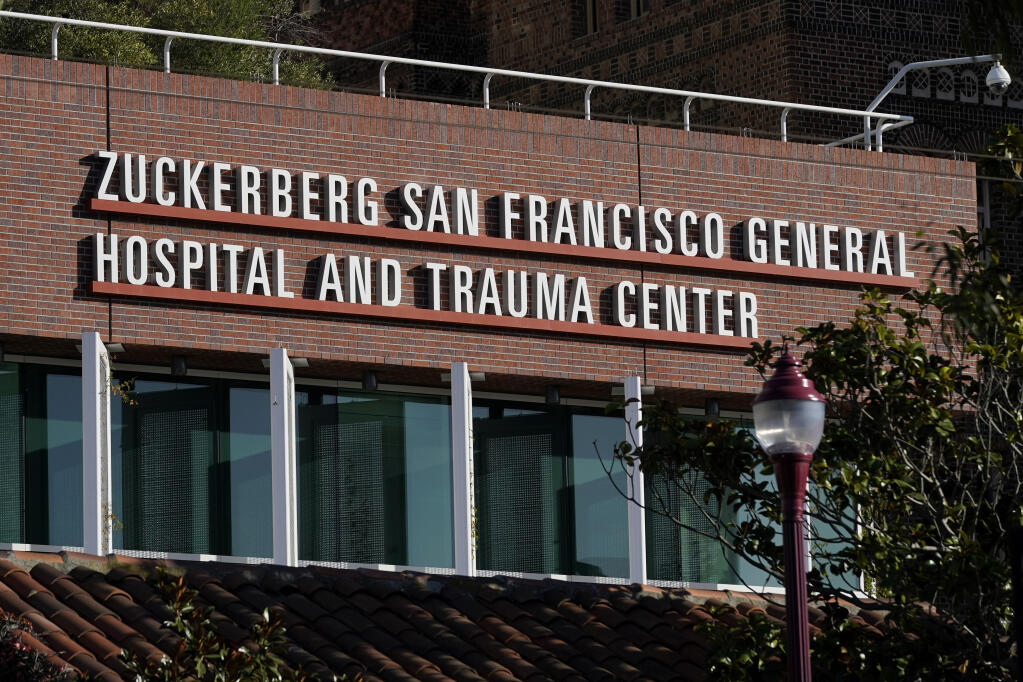 A Zuckerberg San Francisco General Hospital and Trauma Center sign is shown in San Francisco, Monday, Dec. 14, 2020. (AP Photo/Jeff Chiu)