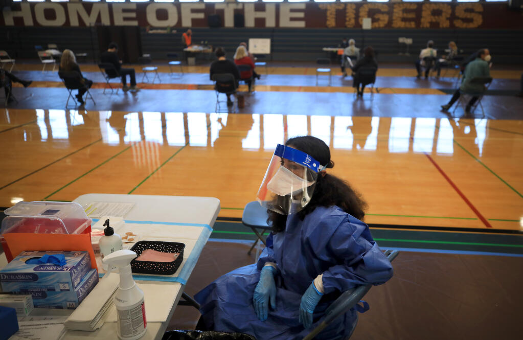 Sonoma County Public Health Officer Sundari R. Mase, Saturday, March 6, 2021 waits for her next patient as she volunteers at West County Health Center's vaccine clinic at Analy High School in Sebastopol.   (Kent Porter / The Press Democrat) 2021