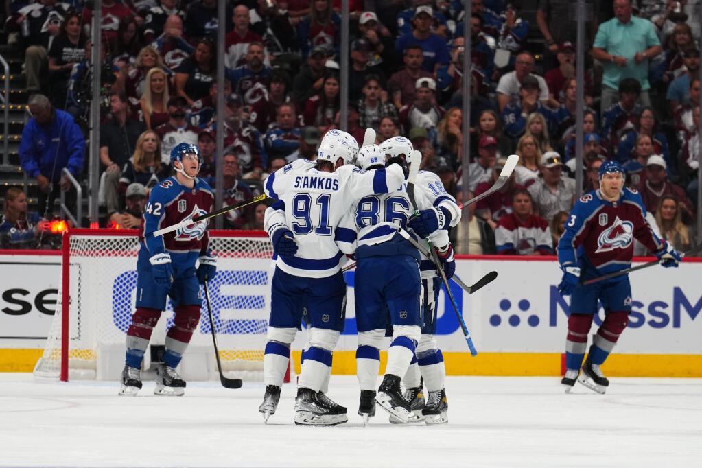 Tampa Bay Lightning right wing Nikita Kucherov, at center, is congratulated by teammates after his goal against the Colorado Avalanche during the second period in Game 5 of the Stanley Cup Final on Friday, June 24, 2022, in Denver. (Jack Dempsey / ASSOCIATED PRESS)