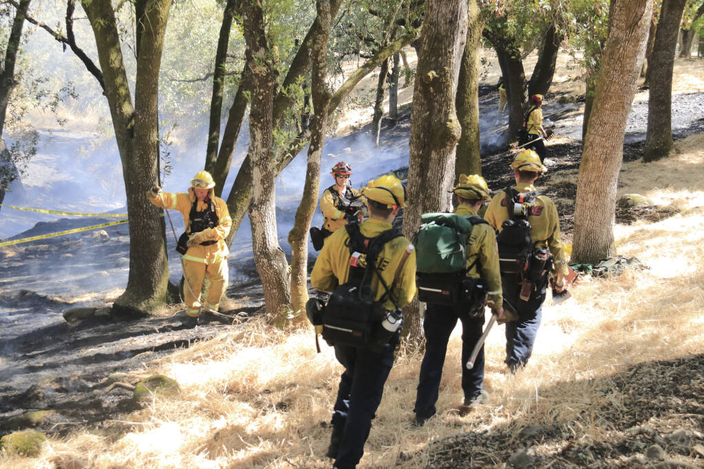 Sonoma Valley Fire and Cal Fire responders at the scene of a small brush fire in the Agua Caliente canyon, just off Barcelona Dr. in the Springs area of Sonoma, on June 11, 2021. The fire burned less than an acre and was contained by 5 p.m. (Christian Kallen/Index-Tribune)