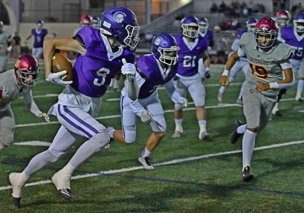 Petaluma’s Thomas Flannery heads downfield after making a key reception in the Trojans’ first touchdown drive against Vintage on Sept. 30, 2022. (Sumner Fowler / For the Argus-Courier)