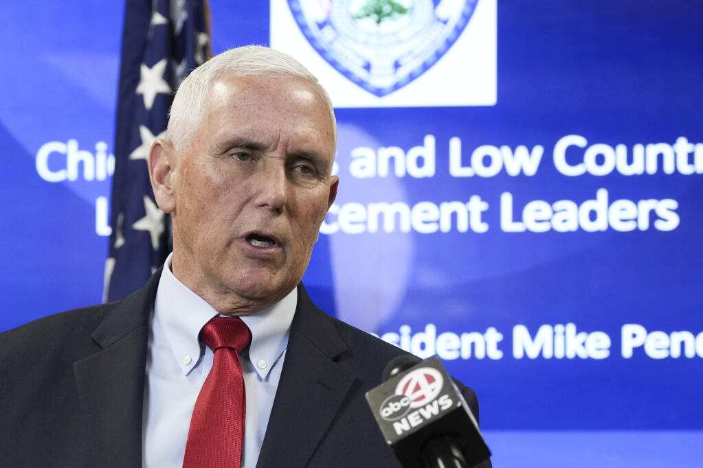 Former Vice President Mike Pence speaks with reporters following a roundtable discussion on police reform on Thursday, March 2, 2023, in North Charleston, S.C. (AP Photo/Meg Kinnard)