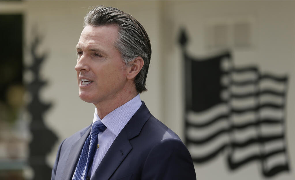 FILE - In this Friday, May 22, 2020, file photo, California Gov. Gavin Newsom speaks during a news conference at the Veterans Home of California in Yountville, Calif.  (AP Photo/Eric Risberg, Pool, File)