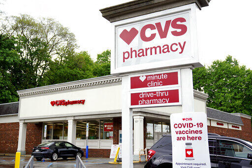 Vehicles are parked in front of  a CVS Pharmacy in Mount Lebanon, Pa., on Monday May 3, 2021.  (AP Photo/Gene J. Puskar)