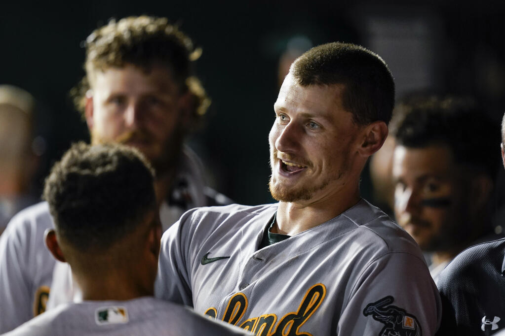 Oakland Athletics’ Sean Murphy, center, smiles after his grand slam during the fifth inning Tuesday against the Nationals in Washington. (Alex Brandon / ASSOCIATED PRESS)