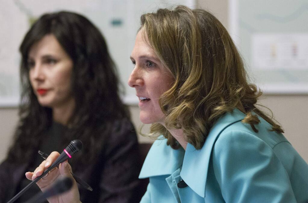 Councilmembers Amy Harrington, foreground, and Rachel Hundley, shown at a meeting in 2018, aired their differing opinions Dec. 14 on whether Hundley has had an inappropriate financial relationship with a cannabis business at the center of a council vote.