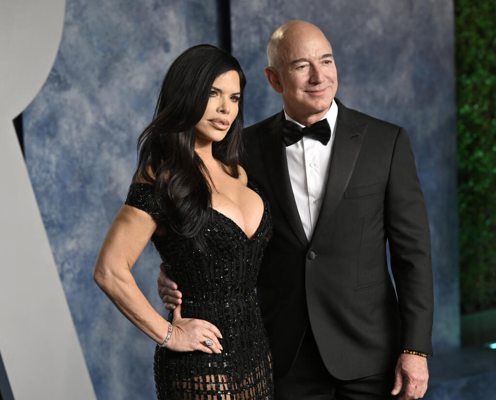 Lauren Sanchez, left, and Jeff Bezos arrive at the Vanity Fair Oscar Party on Sunday, March 12, 2023, at the Wallis Annenberg Center for the Performing Arts in Beverly Hills, Calif. (Photo by Evan Agostini/Invision/AP)