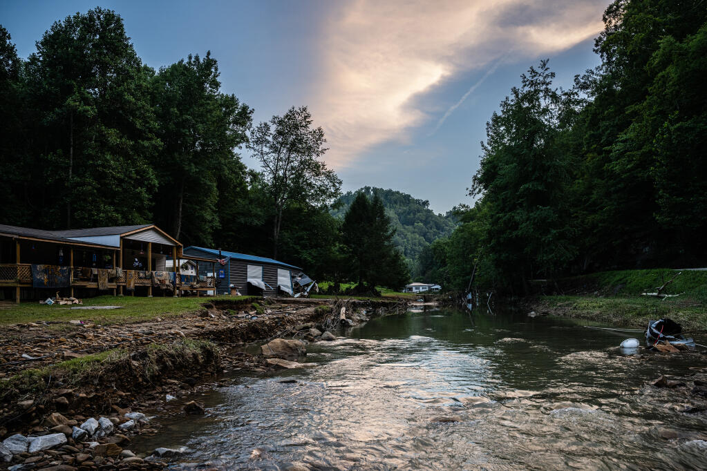 A flooded creek in Buckhorn, Ky., on Saturday, July 31, 2022. As officials braced for the death toll to climb, family members shared memories of those lost. (Jon Cherry/The New York Times)