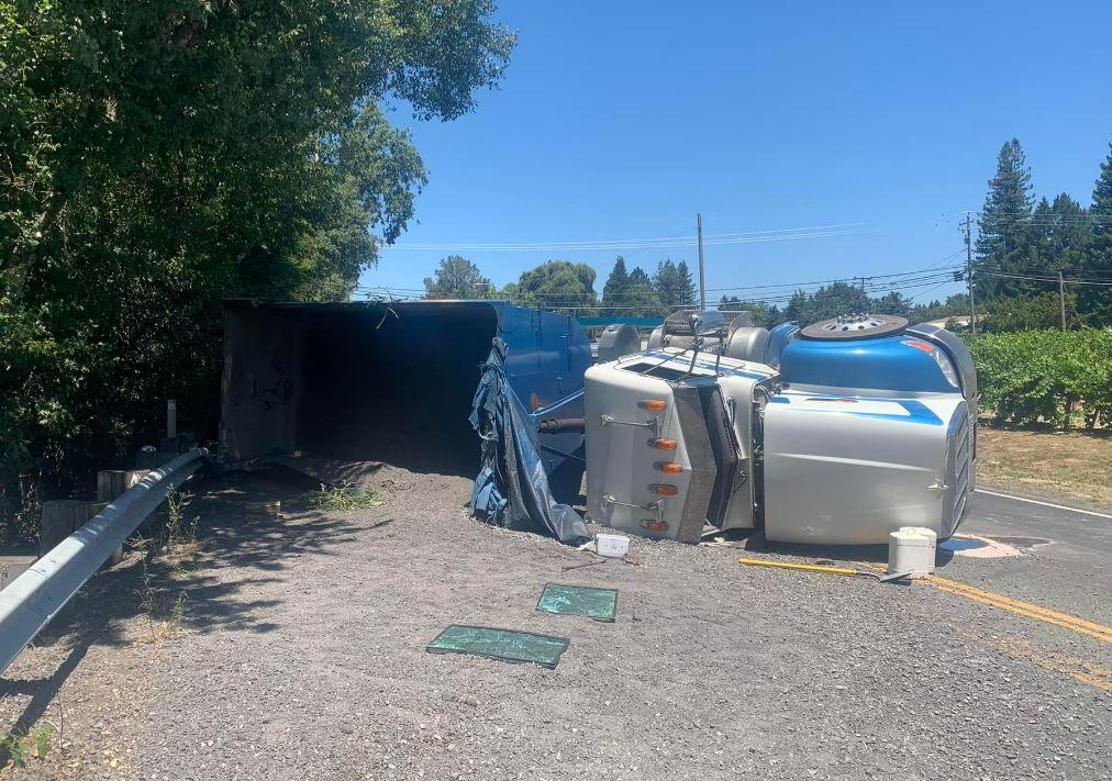 This photo shows an overturned big rig on Highway 116 in Graton Friday, June 24, 2022.(Graton Fire Department)