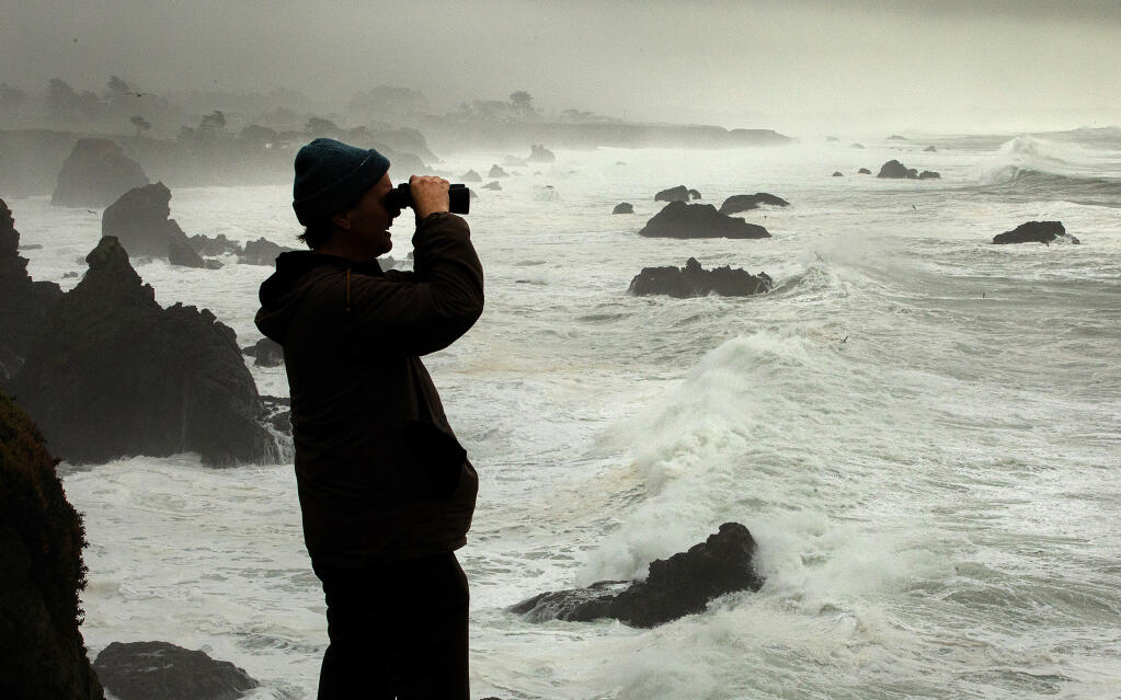 Grant Kjos drove up from his home in San Francisco to watch the giant waves pound the Sonoma Coast at Duncan’s Cove Friday, January 13, 2023.  (John Burgess/The Press Democrat)
