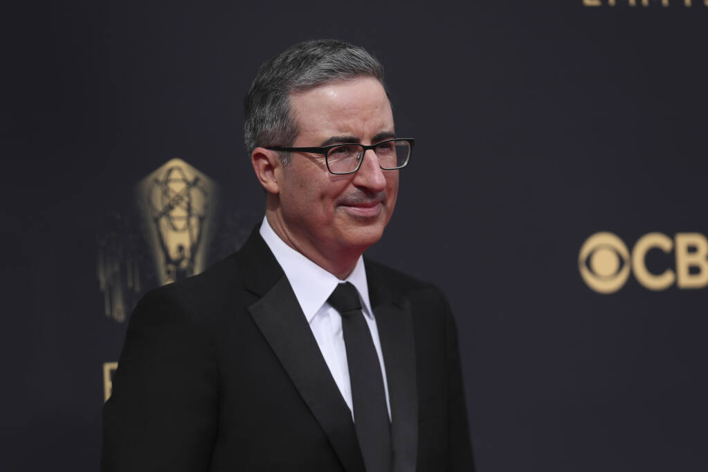 John Oliver arrives at the 73rd Emmy Awards at the JW Marriott on Sunday, Sept. 19, 2021 at L.A. LIVE in Los Angeles. (Photo by Danny Moloshok/Invision for the Television Academy/AP Images)