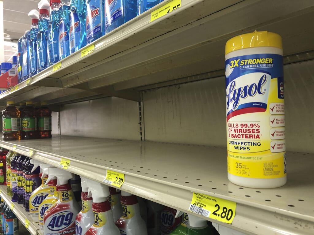 FILE - This March 13, 2020, file photo shows a package of Lysol disinfectant wipes on a shelf at a store in Athens, Ga. Disinfectant wipes are harder to find on store shelves, and businesses are going all out to reassure customers with stepped up sanitation measures. To avoid any traces of the coronavirus that might be lurking on surfaces, Americans have been wiping down groceries, wearing surgical gloves in public and leaving mail packages out for an extra day or two. But experts say fear of being infected by touching something can be overblown. (Joshua L. Jones/Athens Banner-Herald via AP, File)