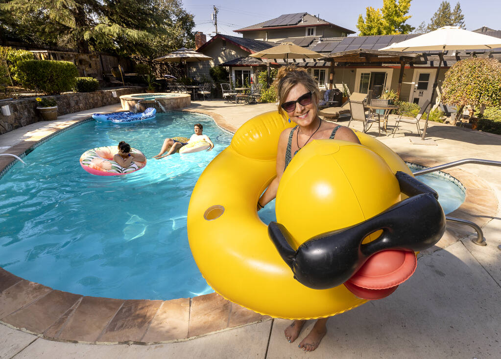 Kathy Housman rents out her swimming pool in the backyard of her Sebastopol home September 8, 2022.  Houseman says it’s been easy to use the swimply.com app to charge visitors by the hour to seek relief from the recent heat wave. (John Burgess/The Press Democrat)