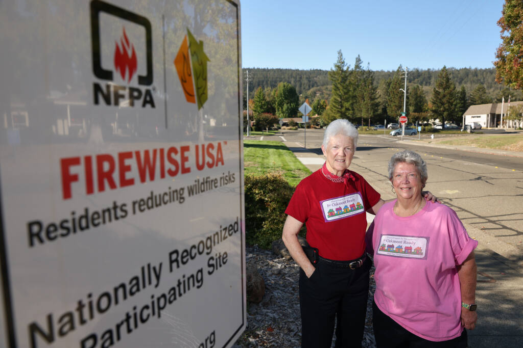 Iris Harrell, left, liaison for the Oakmont Firewise committee, and Katy Carrel, with Map Your Neighborhood, worked to make their community of Oakmont more prepared for the next disaster. Photo taken in the Oakmont community in Santa Rosa, Wednesday, Oct. 19, 2022. (Christopher Chung/The Press Democrat)