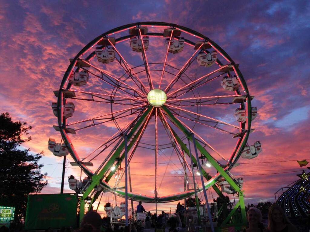 The sun sets behind a Ferris wheel during a previous Sonoma-Marin Fair at Petaluma’s fairgrounds. (Jim Johnson/For the Argus-Courier)