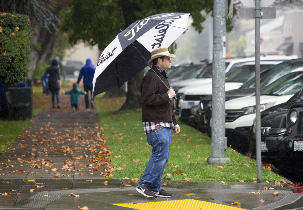 Another rainy day in Sonoma didn’t stop some from wandering around the Plaza on Tuesday, Nov. 9, 2021. (Photo by Robbi Pengelly/Index-Tribune)