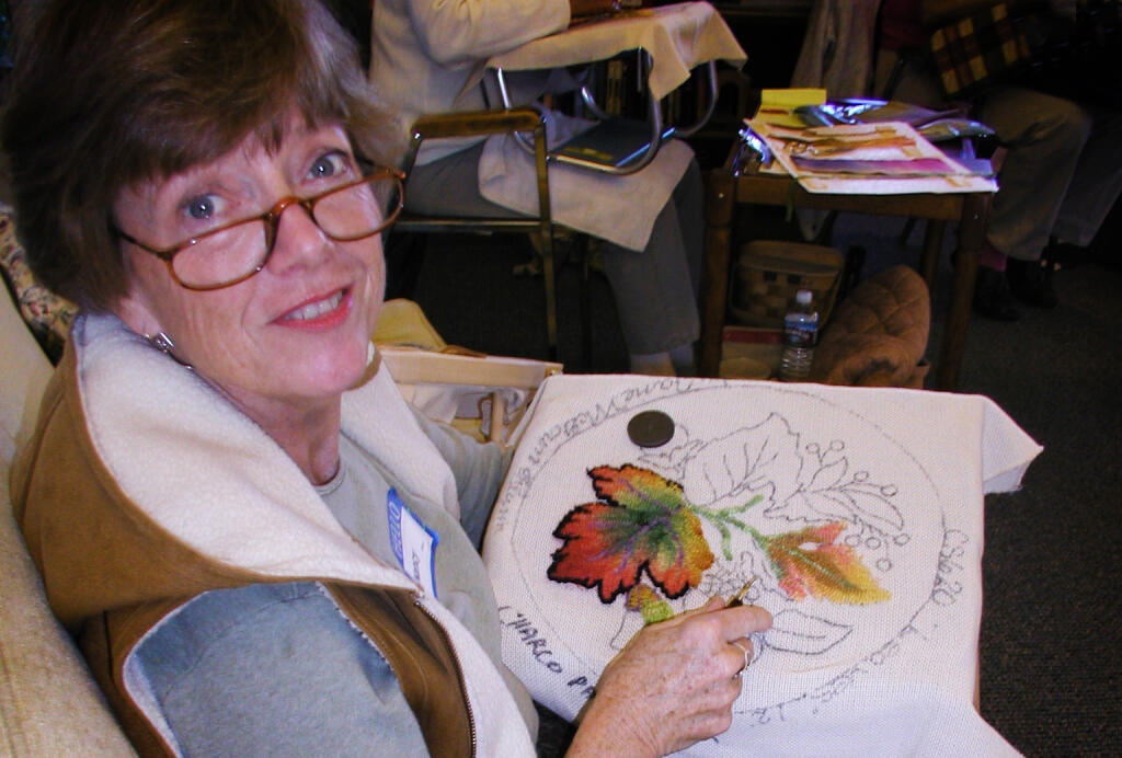 Nancy Winn, a member of the Wine Country Rug Hooker’s Guild, demonstrates the art of hooking leaves. An exhibition of the guild’s works will be on display at Sonoma Valley Regional Library throughout April. (Courtesy of Diane Campagna)
