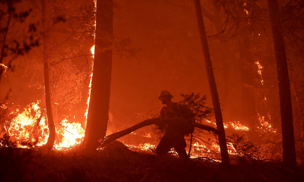 The Tehachapi Valley 11 crew cut miles of fire break in the Rush Creek area of the Feather River Canyon, July 25, 2021. (Kent Porter / The Press Democrat)