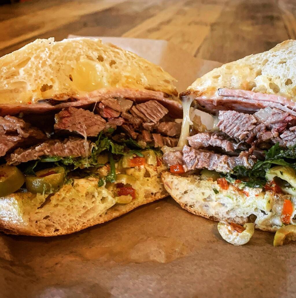 Butcher Crown Roadhouse’s new “The Bourdain” sandwich, a mix between a Cubano and a Chivito that pays homage to legendary chef Anthony Bourdain. (COURTESY OF BUTCHER CROWN ROADHOUSE)