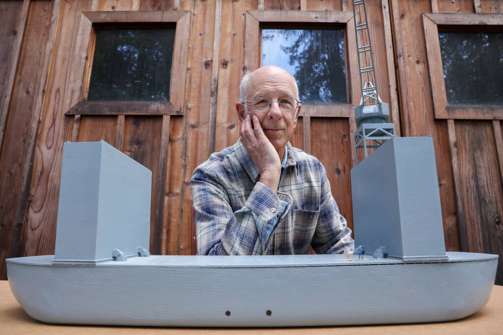 Andy Werback proudly displays a 1/100-scale replica of a World War II Advanced Base Sectional Dock, which he built and is giving to the South Pacific WWII Museum on Espiritu Santo. Photo taken near Sebastopol on Monday, Feb. 27, 2023.  (Christopher Chung / The Press Democrat)