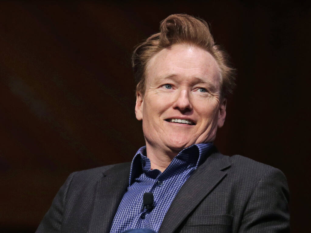 Television host Conan O'Brien smiles towards the audience at Sanders Theatre on the campus of Harvard University in Cambridge, Friday, Feb. 12, 2016.  O'Brien hosts this year’s online Monte Rio Variety Show, available now. (AP Photo/Charles Krupa)