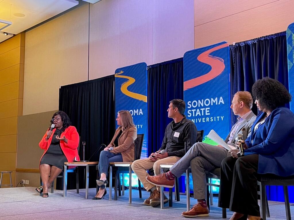 Panelists discuss job and economic trends for their businesses at the North Bay Business Journal’s 29th annual Economic Outlook Conference at Sonoma State University on Wednesday, March 9, 2022. From left are Letitia Hanke, CEO and president of ARS Roofing, Gutters and Solar Inc, and founder and executive director of the LIME founation; Whitney Diver McEvoy, president and CEO of the Yountville Chamber of Commerce; Erich Pearson, CEO and chairman of SPARC; Mike Blakeley, CEO of Marin Economic Forum; and Lorez Bailey, moderator and publisher of the North Bay Business Journal. (Brandelle McIntosh / for North Bay Business Journal)