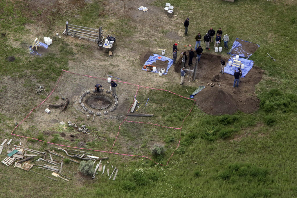 FILE - In this aerial photo, investigators search for human remains at Chad Daybell's residence in Salem, Idaho, on June 9, 2020. The sister of Tammy Daybell, who was killed in what prosecutors say was a doomsday-focused plot, told jurors Friday, April 28, 2023, that her sister's funeral was held so quickly that some family members couldn't attend. The testimony came in the triple murder trial of Lori Vallow Daybell, who is accused along with Chad Daybell in Tammy's death and the deaths of Vallow Daybell's two youngest children. (John Roark/The Idaho Post-Register via AP, File)