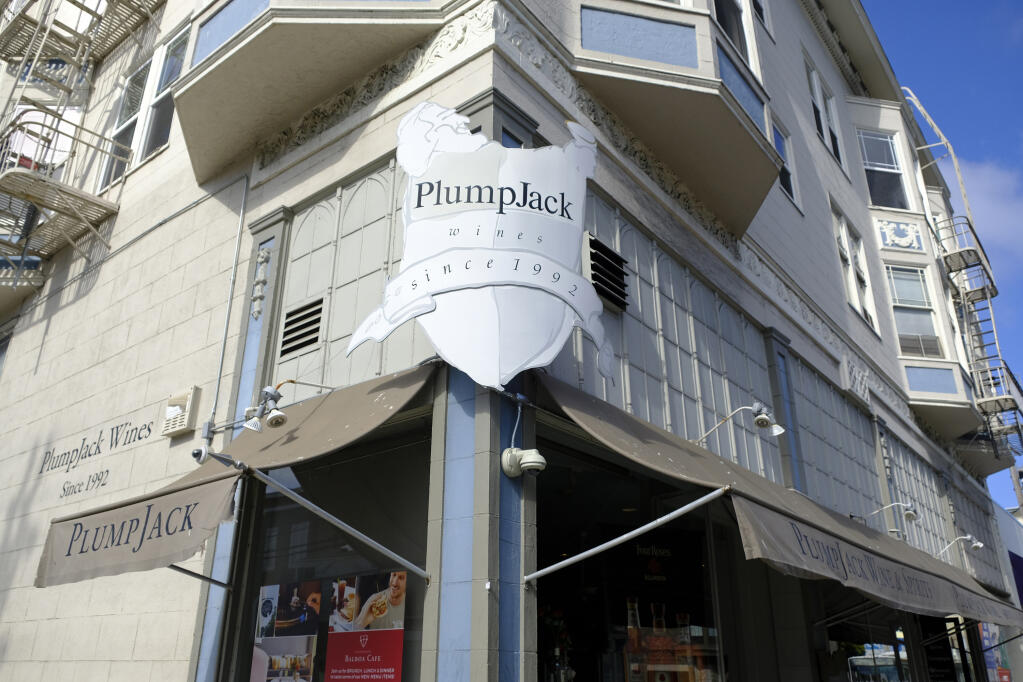FILE - In this Oct. 22, 2018, file photo, is the Plumpjack Wine & Spirits store in San Francisco, part of the Plumpjack Group collection of wineries, bars, restaurants, hotels and liquors stores. Companies affiliated with Gov. Gavin Newsom received nearly $3 million in loans designed to help small businesses survive the pandemic, more than eight times the amount originally reported, according to newly released information from the federal government. Nine businesses tied to Newsom's PlumpJack Group split the nearly $3 million in loans through the Small Business Administration’s Paycheck Protection Program, according to new figures released last week. (AP Photo/Eric Risberg, File)
