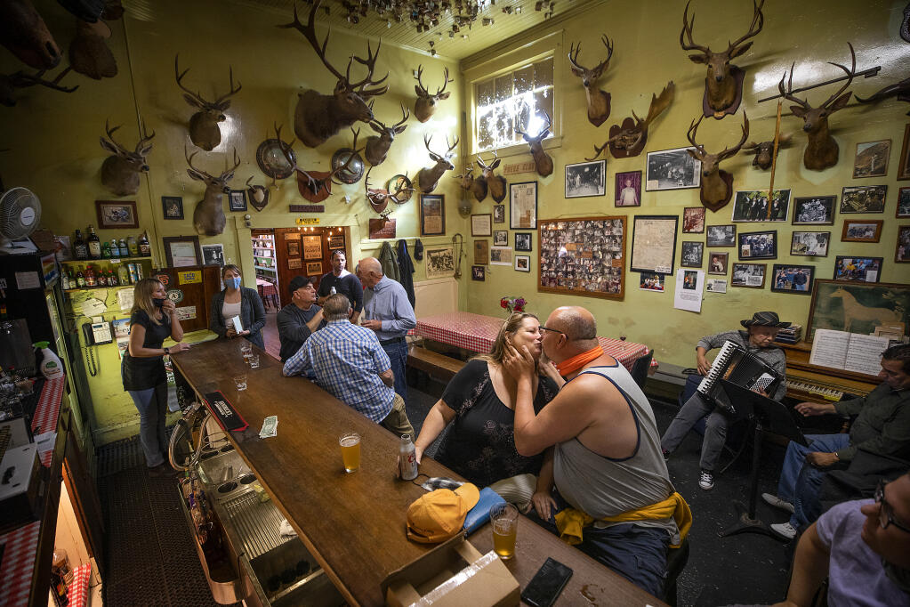The bar at Volpi’s Ristorante & Bar in Petaluma was back in action after a year's hiatus since the start of the pandemic with accordion music, loud Italian songs and kissing at the bar on Thursday, May 6, 2021.  (Photo by John Burgess/The Press Democrat)