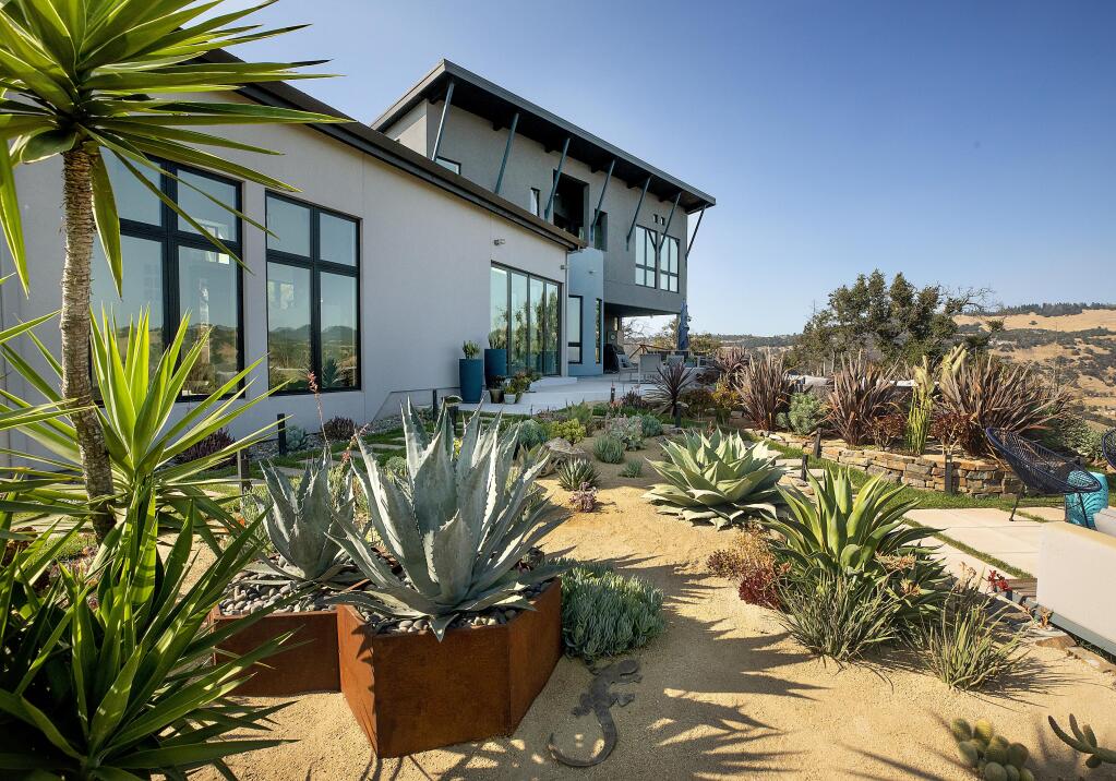 Lisa and Damon Mattson created a southwest desert garden with views over Rincon Valley from the Fountaingrove property that was damaged by the Tubbs Fire. Photo taken Thursday, July 16, 2020. (John Burgess/The Press Democrat)