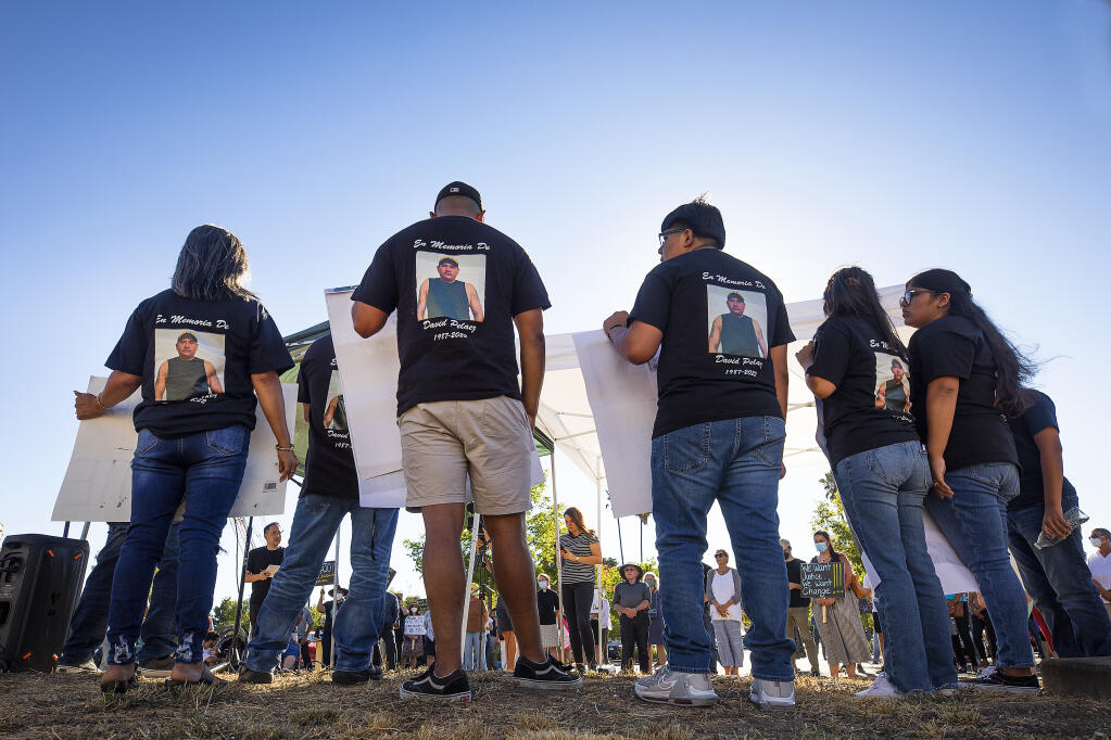 The family of David Pelaez Chavez, wear shirts in his memory during a press conference in front of the Sonoma County Sheriff’s office Monday, August 22, 2022.  (John Burgess/The Press Democrat)