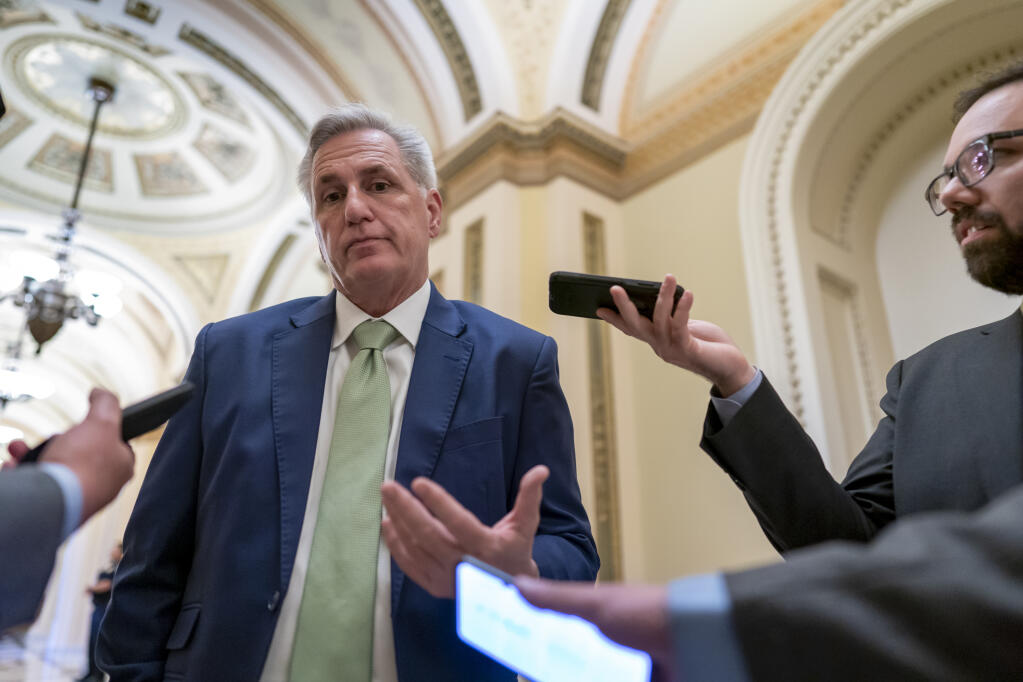 FILE - House Minority Leader Kevin McCarthy, R-Calif., talks to reporters at the Capitol in Washington, April 6, 2022. McCarthy is downplaying secretly recorded remarks he made about Donald Trump shortly after last year's attack on the Capitol. He also says he never told the then-president that he should resign — something that has not been reported. (AP Photo/J. Scott Applewhite, File)