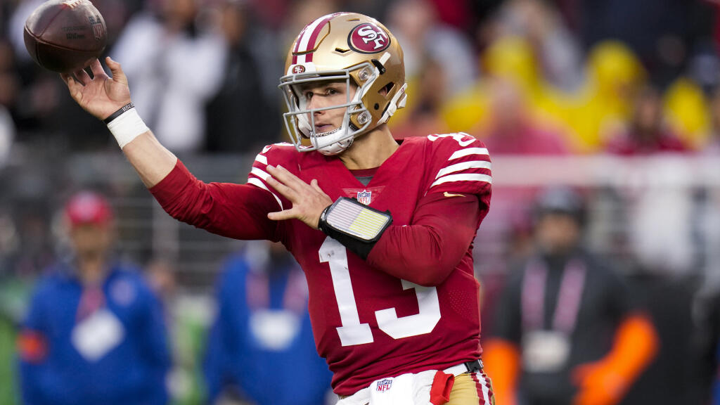 San Francisco 49ers quarterback Brock Purdy (13) passes against the Seattle Seahawks during the second half of an NFL wild card playoff football game in Santa Clara, Calif., Saturday, Jan. 14, 2023. (AP Photo/Godofredo A. Vásquez)
