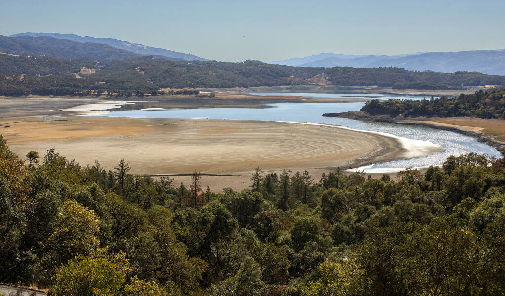 Lake Mendocino on Thursday, Oct. 13, 2021. Two years of drought have exposed much of Lake Mendocino’s lake bed, revealing the top layer of silt that has settled in the bottom since the reservoir was filled in 1959. (John Burgess/The Press Democrat)