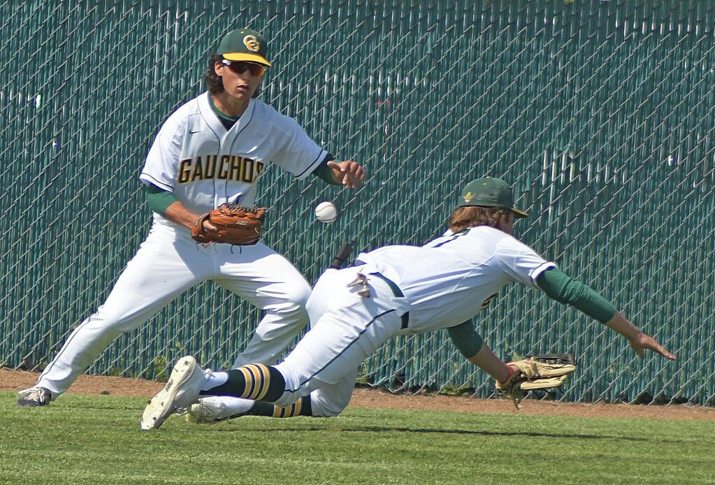 Casa Grande outfielders collide in a play that gave Petaluma a run in a game played at Casa Grande on April 23, 2022. (SUMNER FOWLER / FOR THE ARGUS-COURIER)