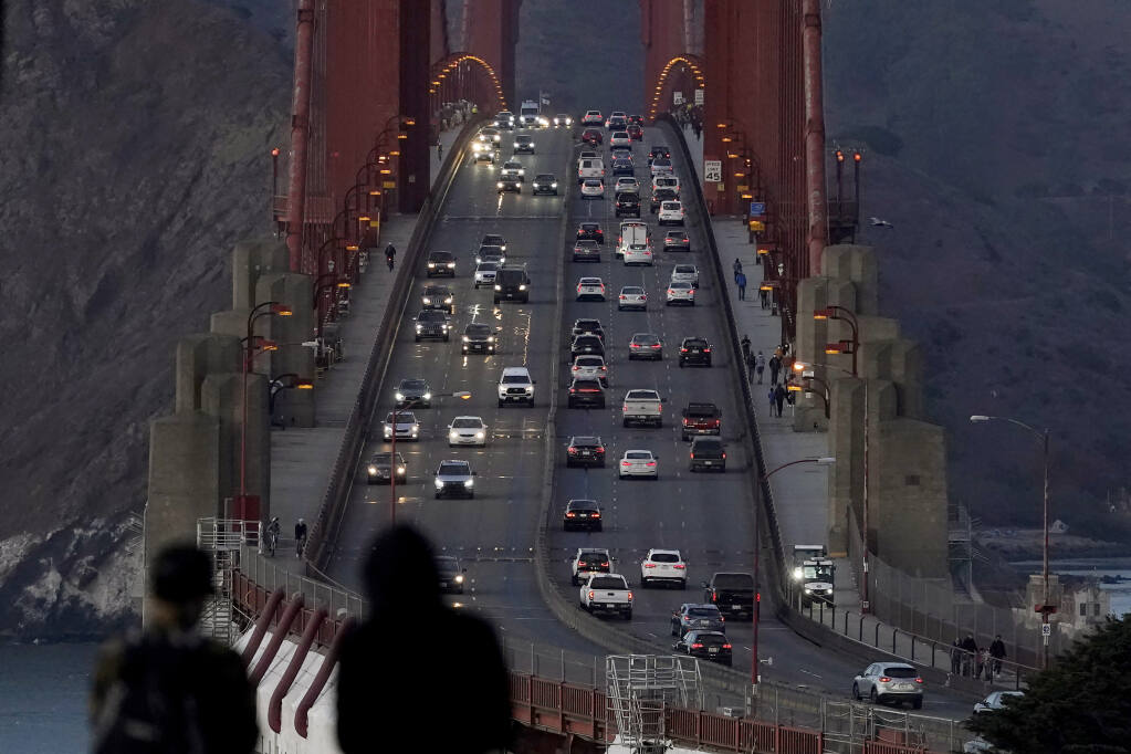 In this Nov. 12, 2020, file photo, traffic moves on the Golden Gate Bridge in San Francisco. (AP Photo/Jeff Chiu, File)